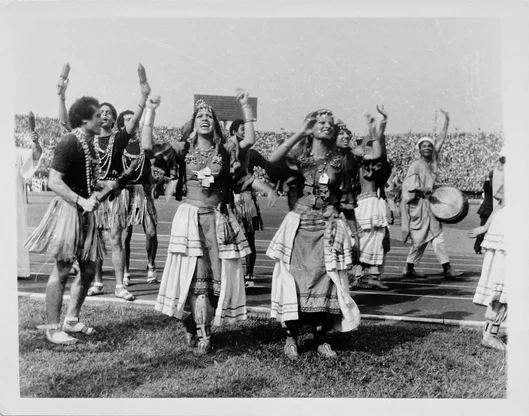 Festival dancers raising their arms